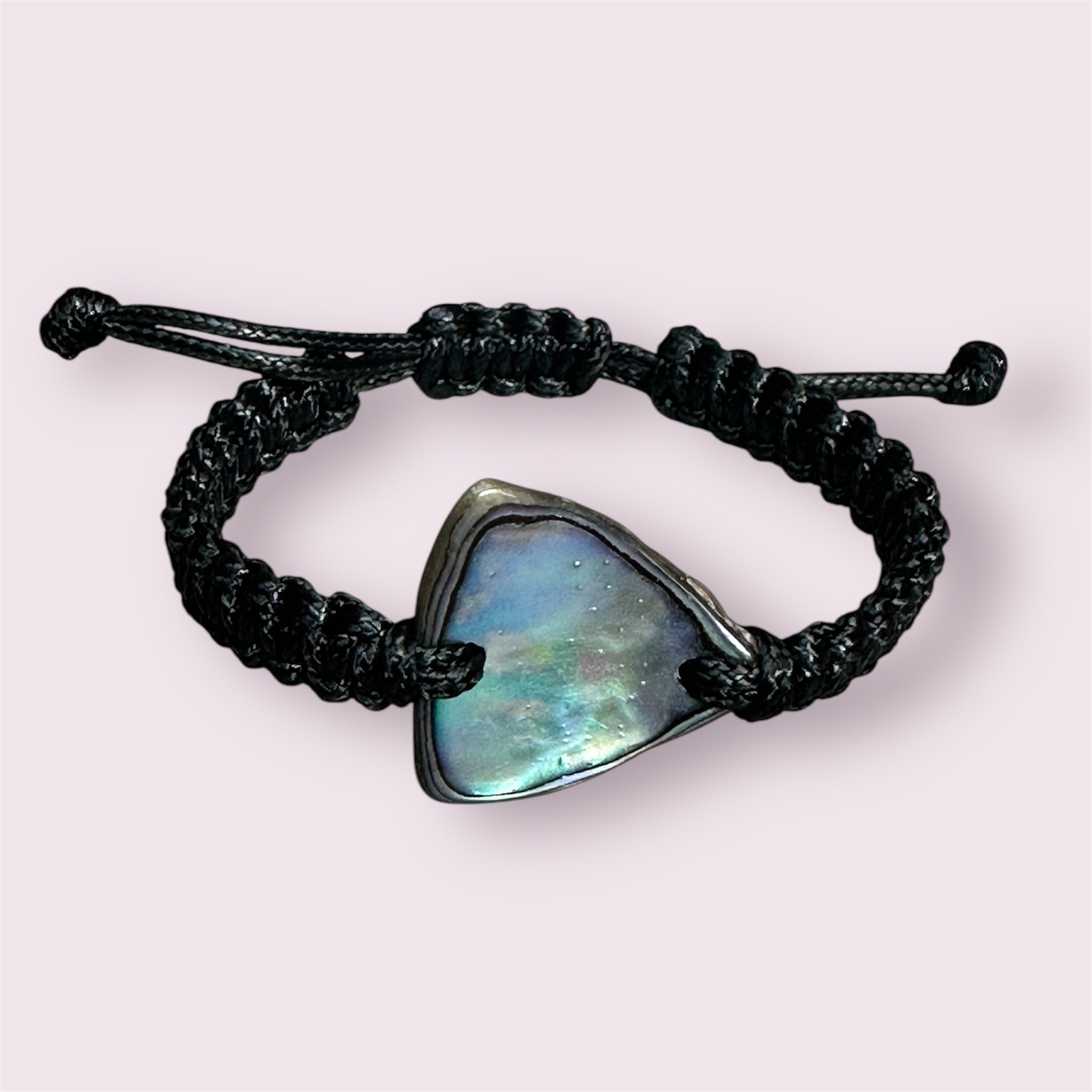 New Zealand Paua shell bracelet with adjustable cord.
