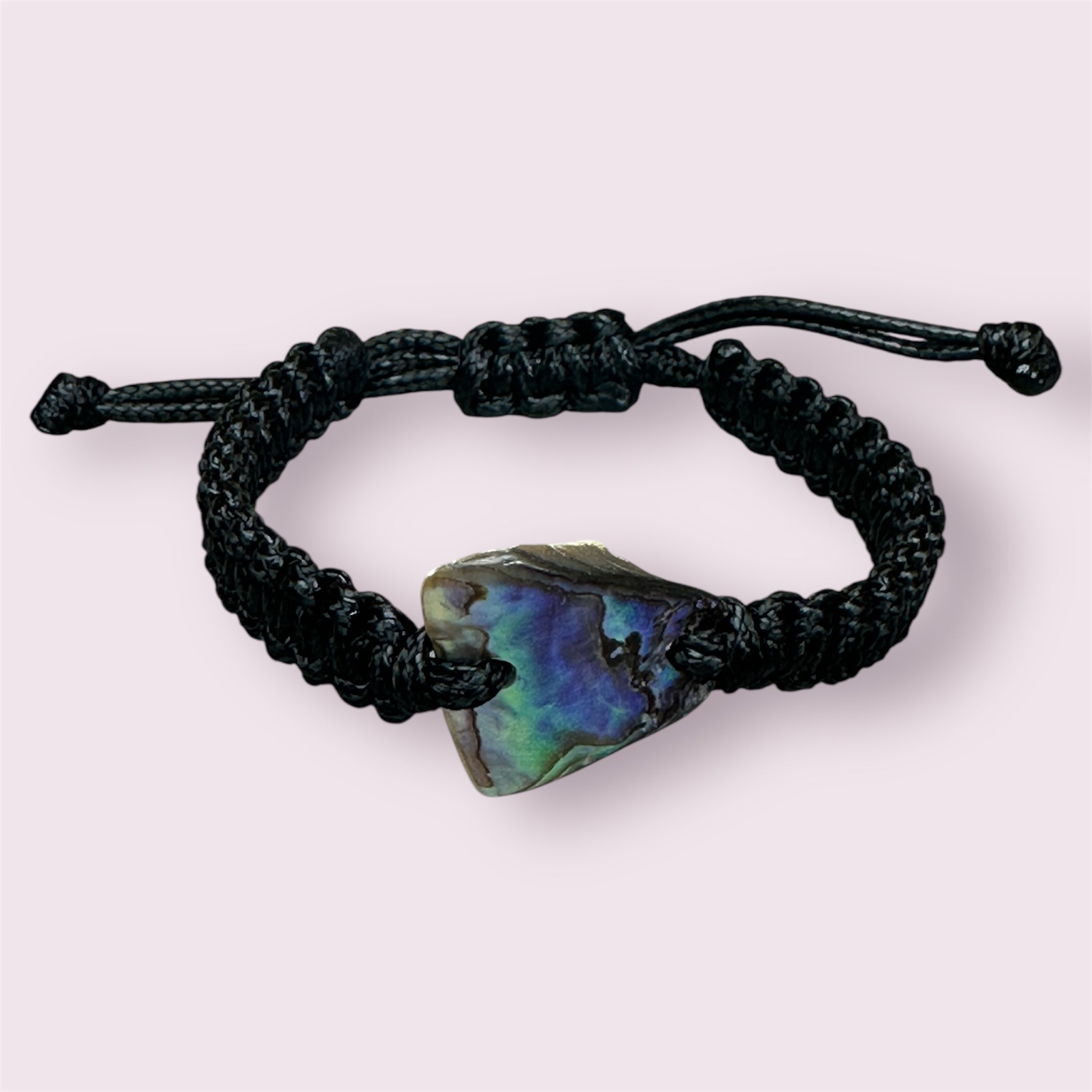 Adjustable black bracelet with unique Paua shell, each with different colour patterns.