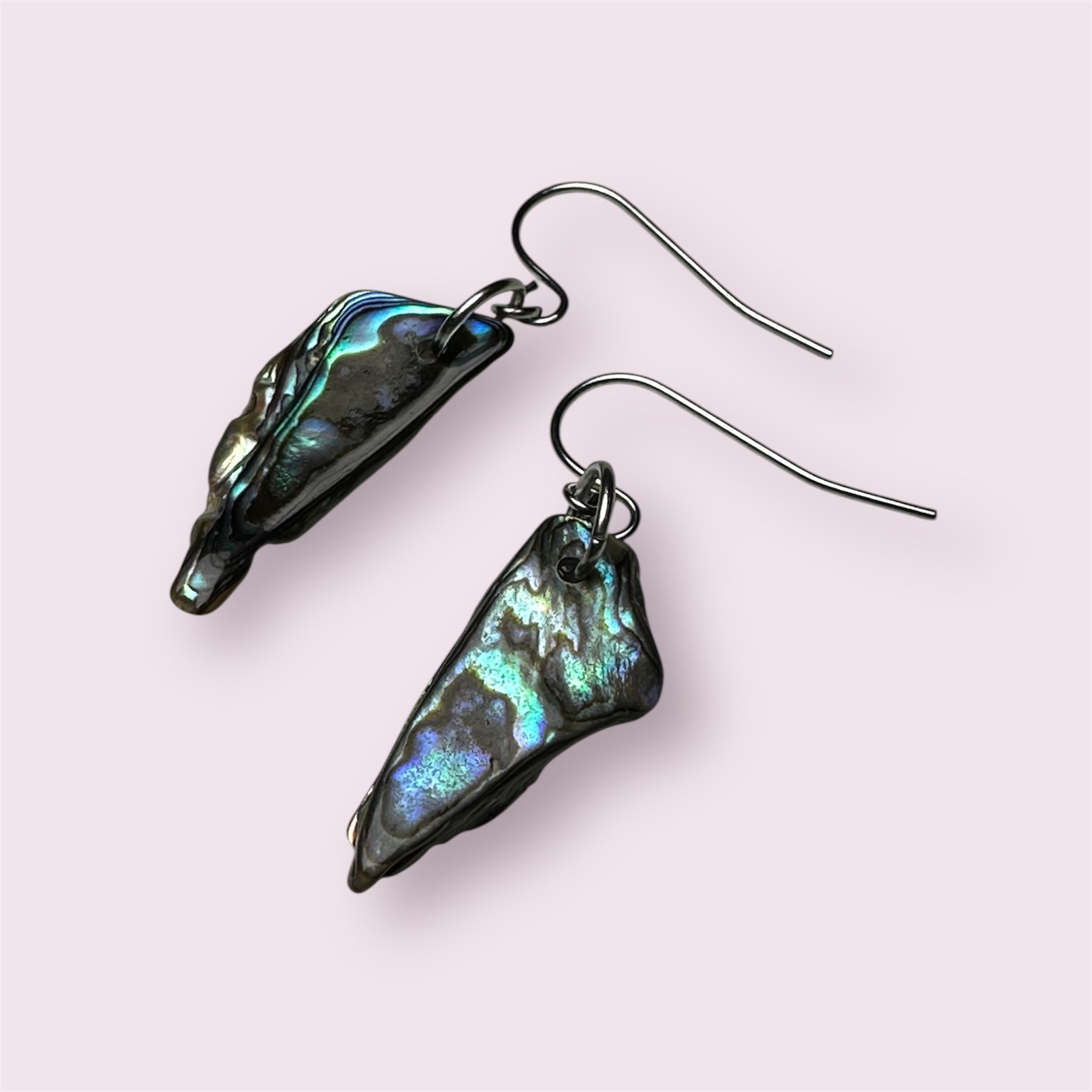 Handmade stainless steel earrings with ocean-toned Paua shell