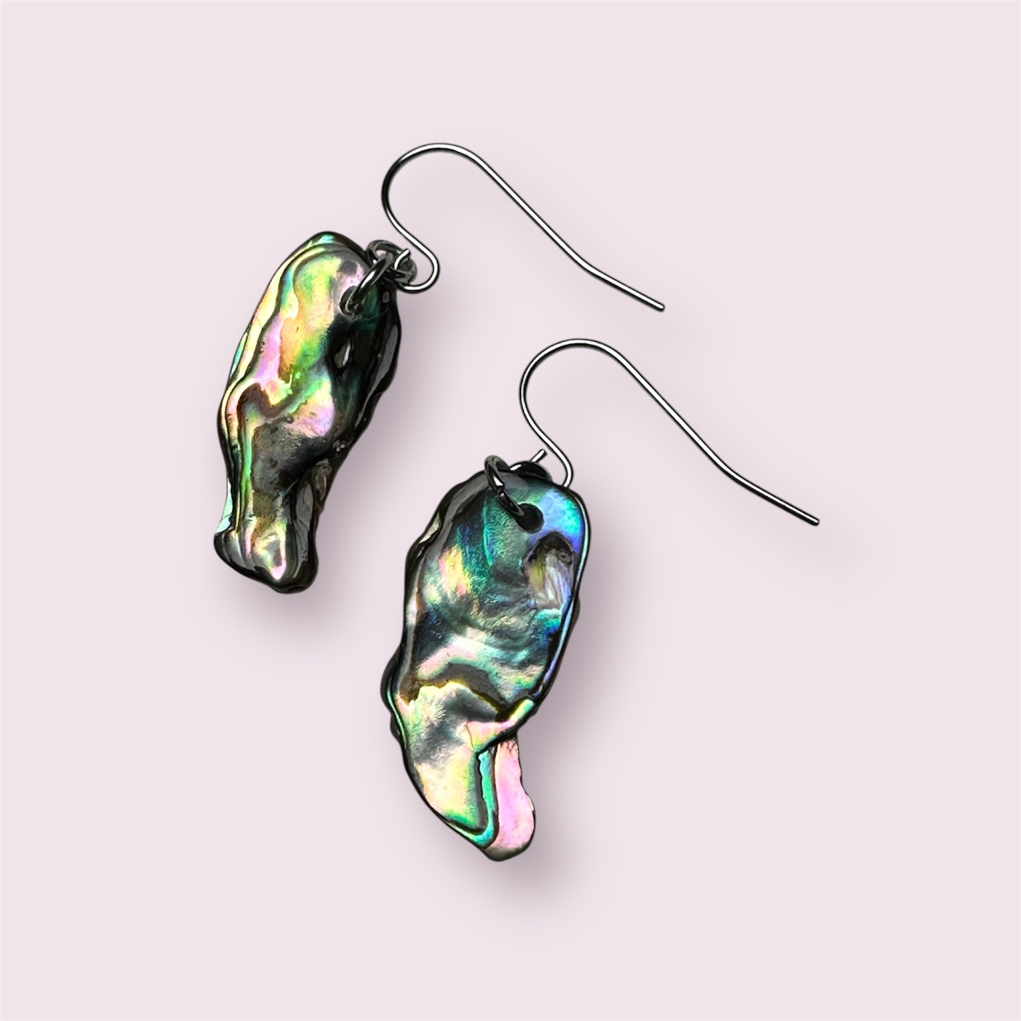 Elegant Paua shell earrings reflecting ocean hues in stainless steel