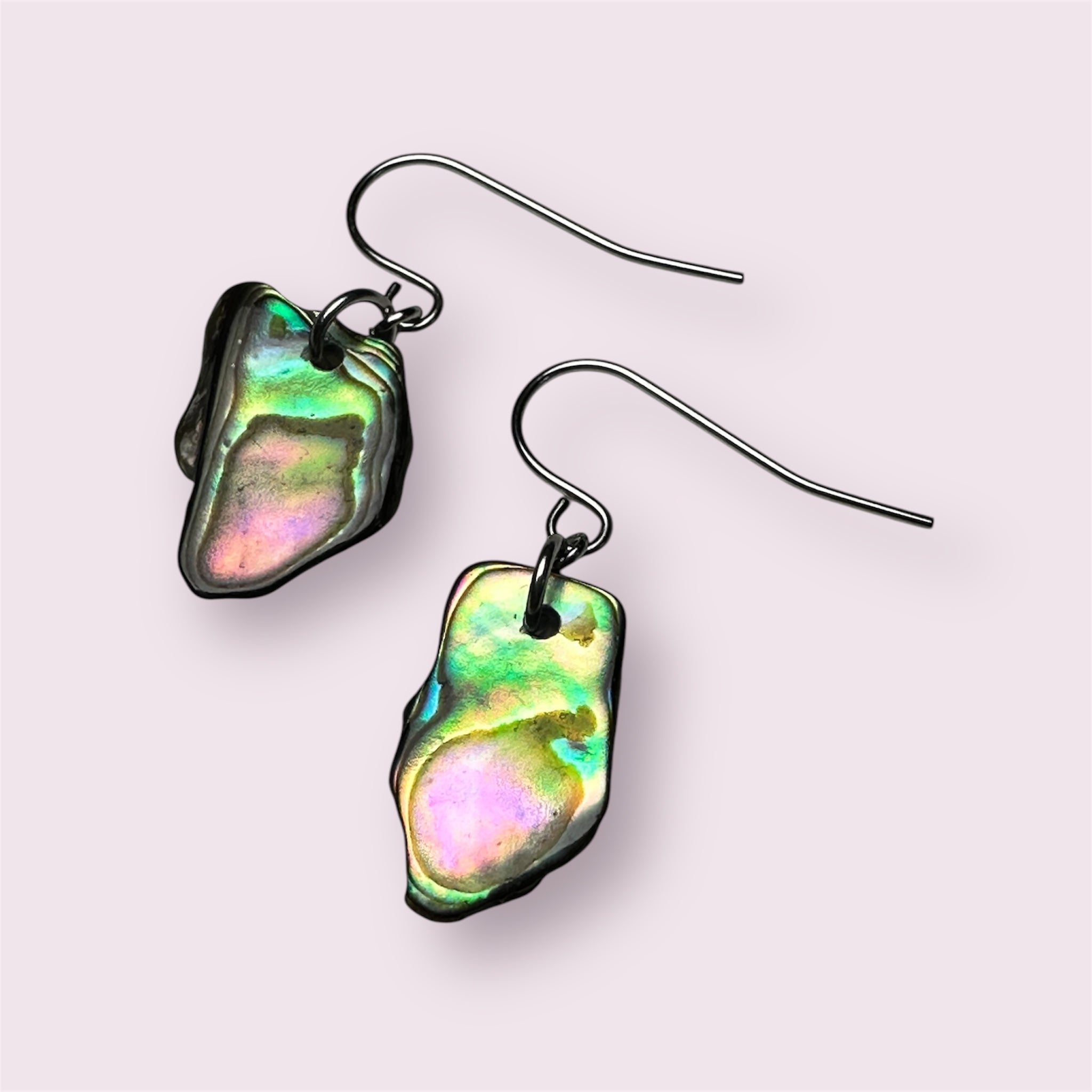 Elegant Paua shell earrings reflecting ocean hues in stainless steel